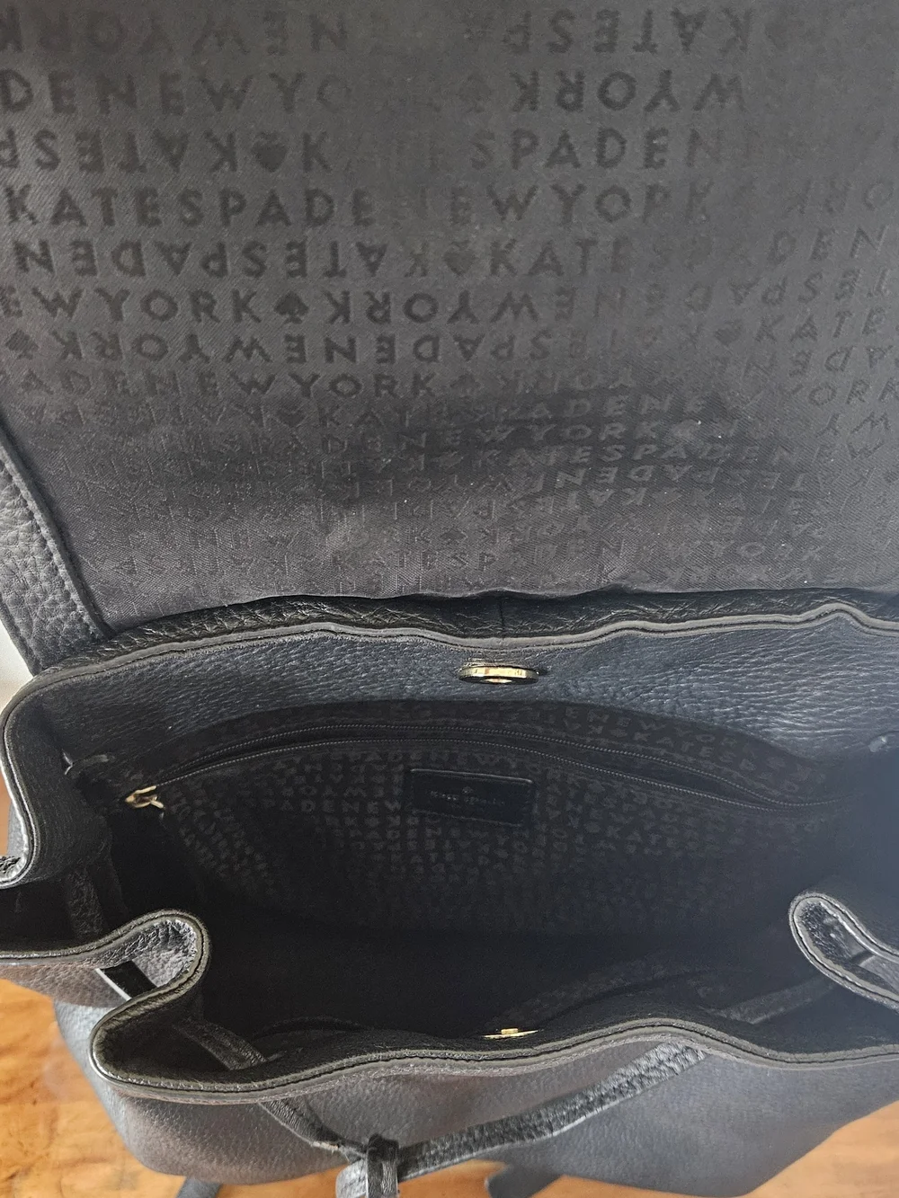 kate spade Black Pebbled Leather Backpack with Tassels